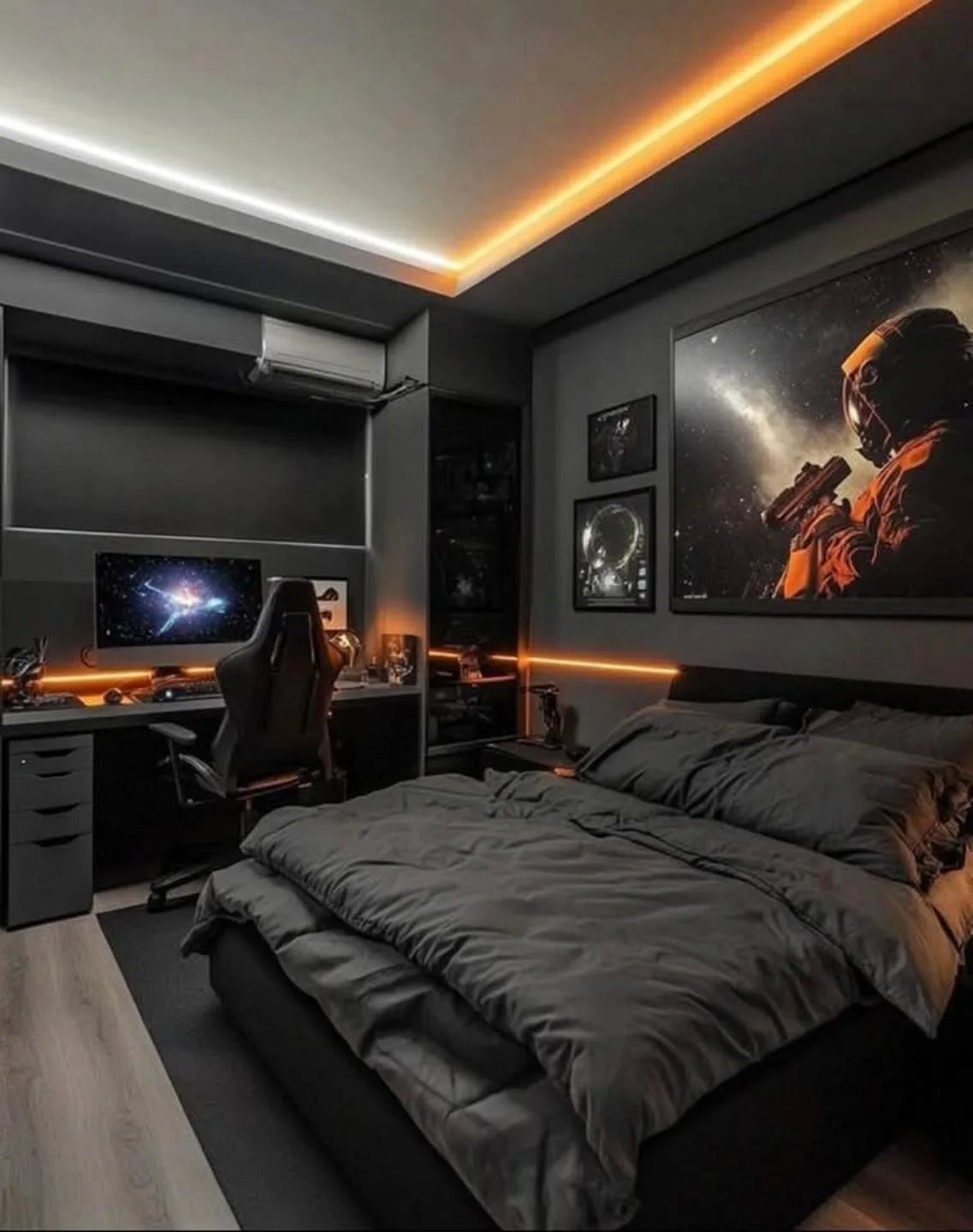 Dark grey bedroom with orange LED lighting, gaming setup, and large wall art.