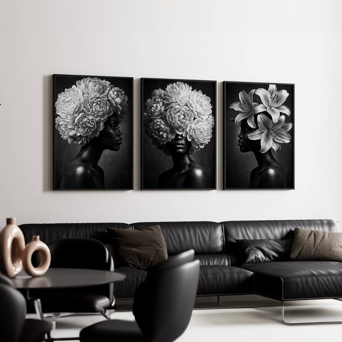 Three black and white floral prints of women hanging above a black leather sofa.