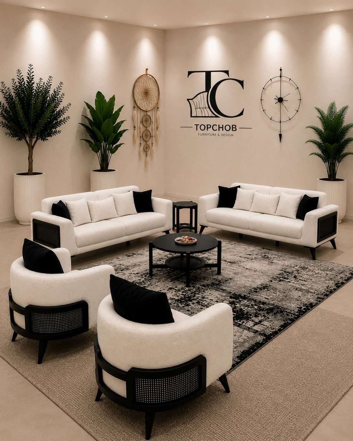 White sofas and armchairs with black frames in a monochrome living room