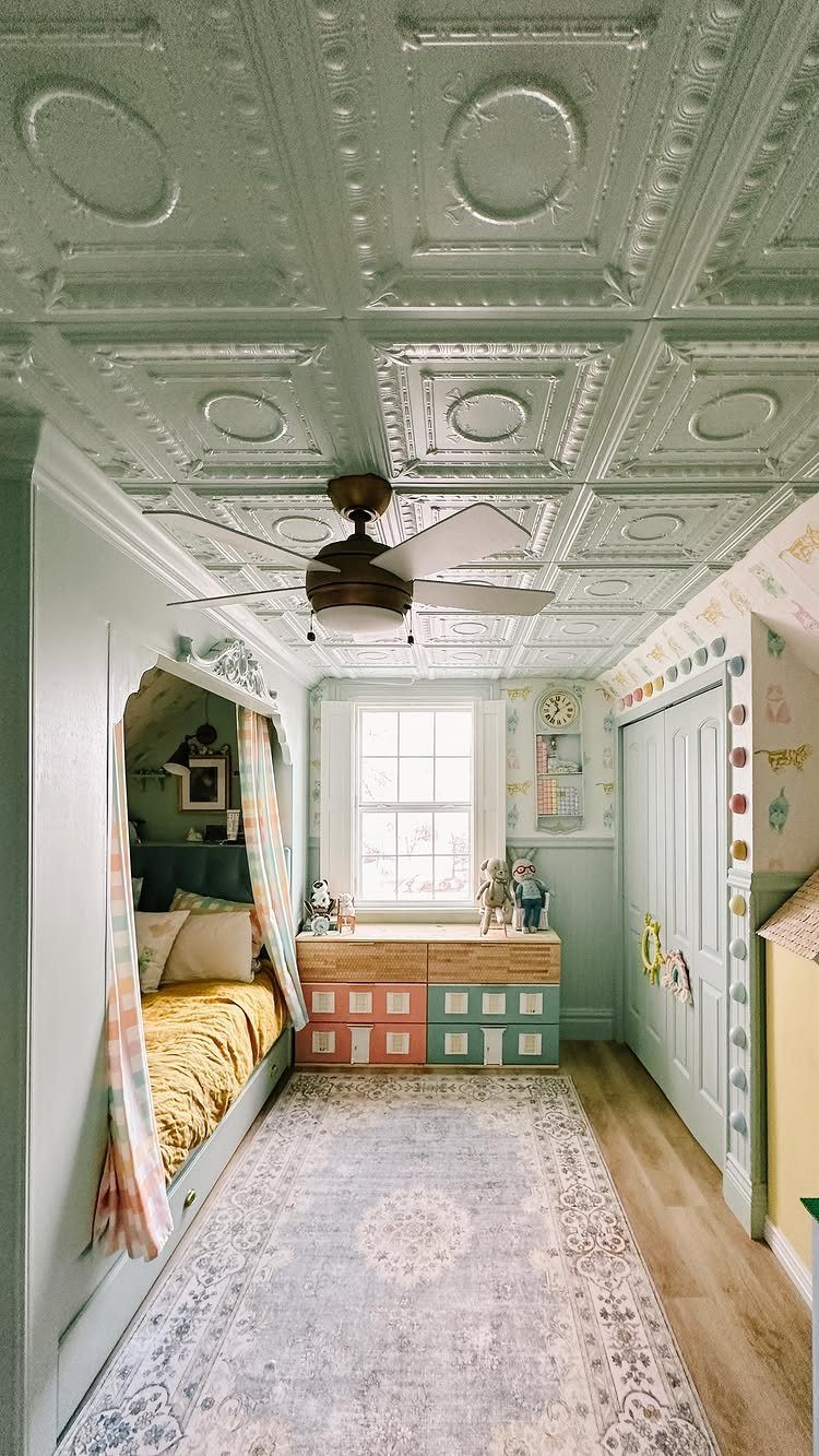 Light green embossed metallic ceiling tiles in a child's bedroom with a ceiling fan.