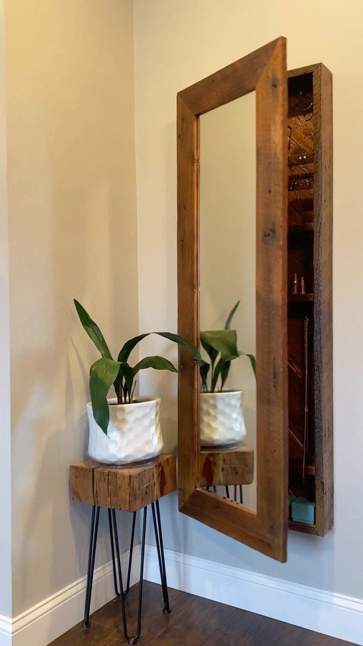 Reclaimed wood mirror cabinet and matching hairpin leg side table with potted plant