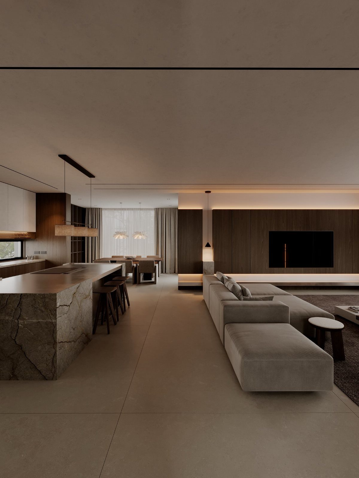 Open concept luxury living room with grey sectional, marble island, and dining area.