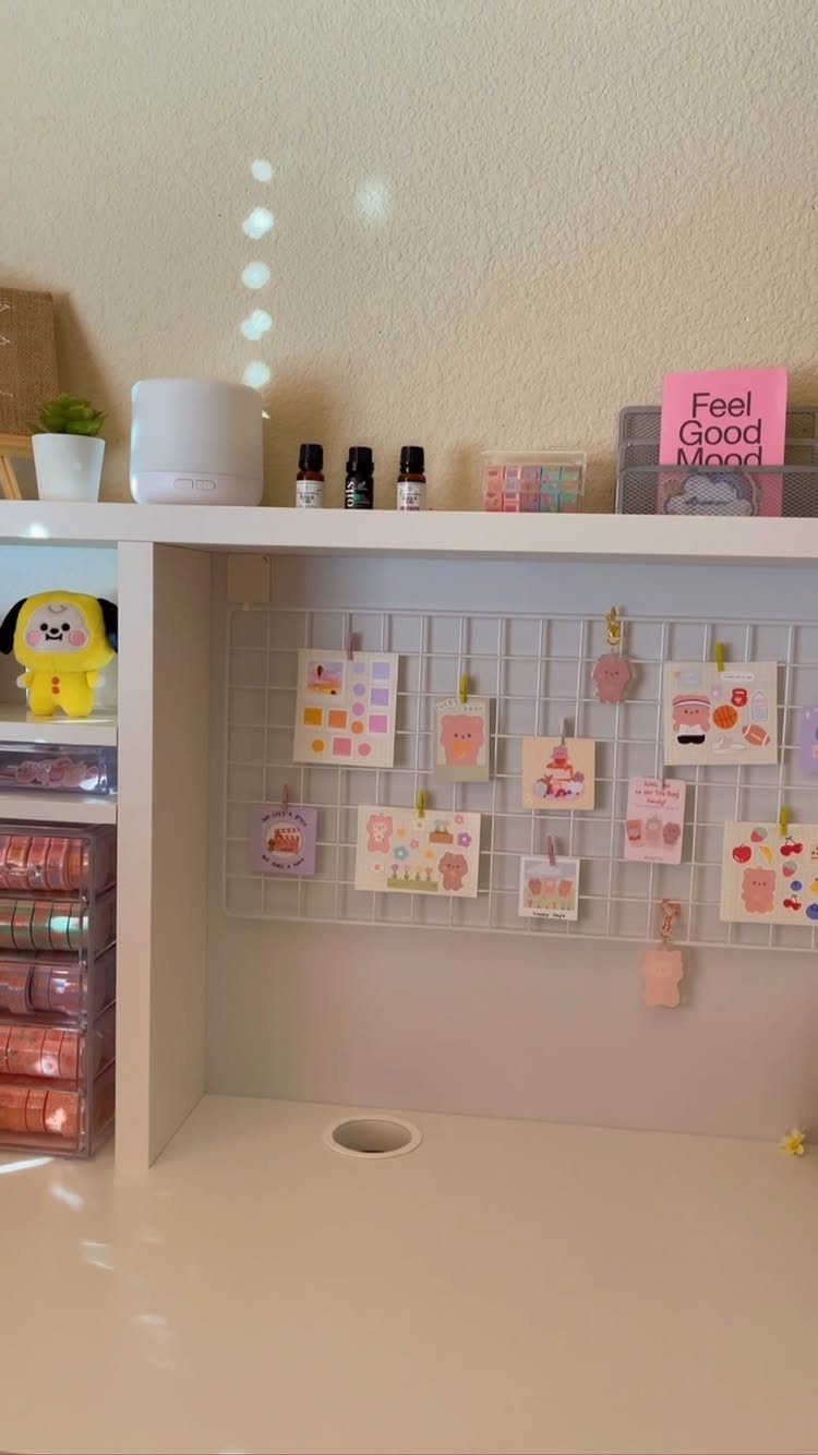 White desk with a wire grid wall decorated with cute colorful cards