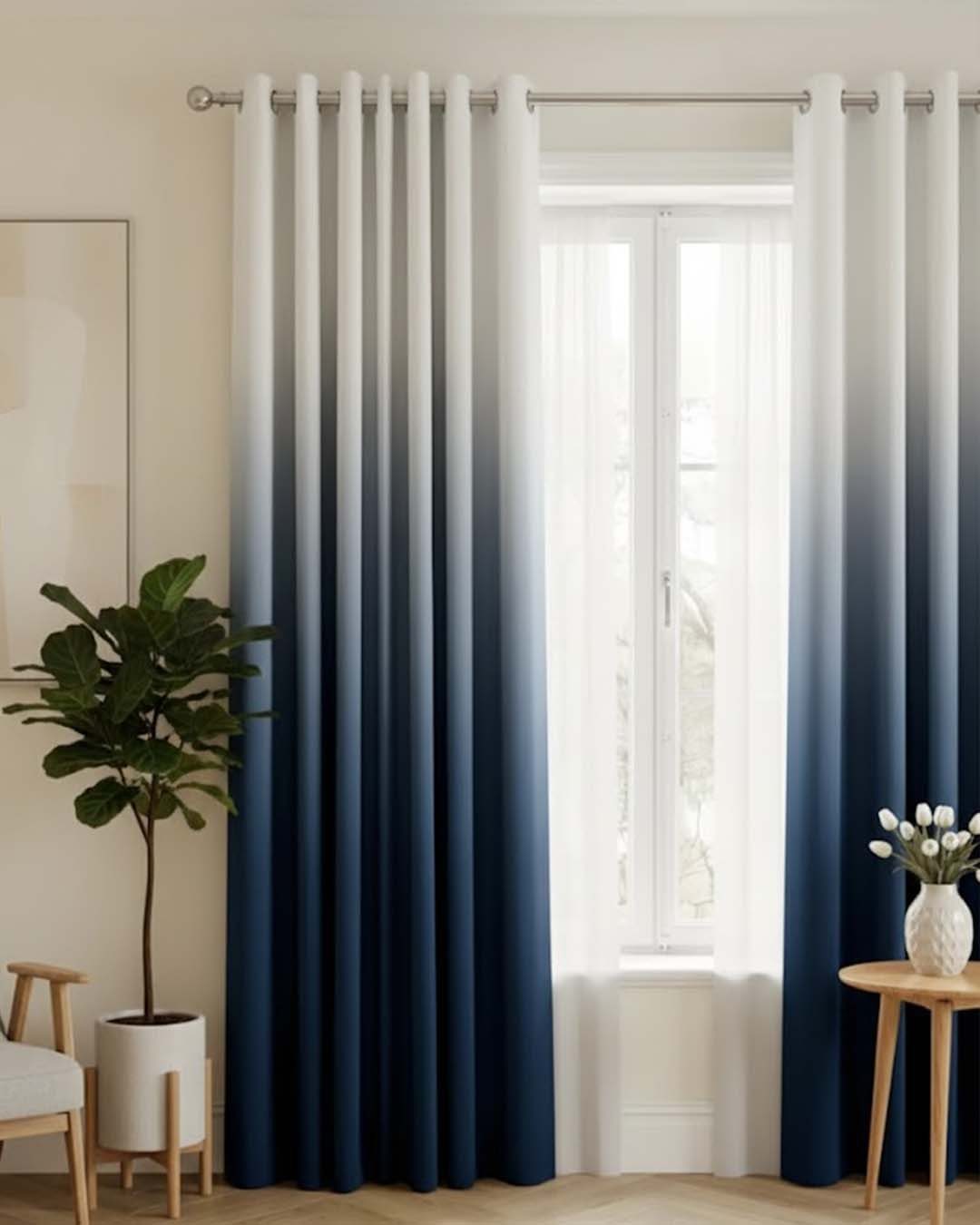 Ombre gradient curtains transitioning from white to navy blue in a bright room.