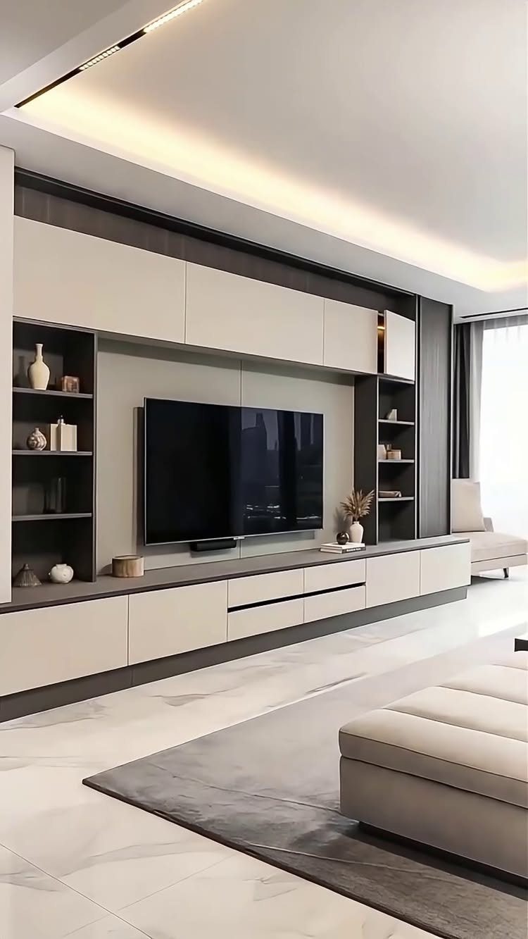 Modern drawing room with a large built-in TV unit and beige furniture.