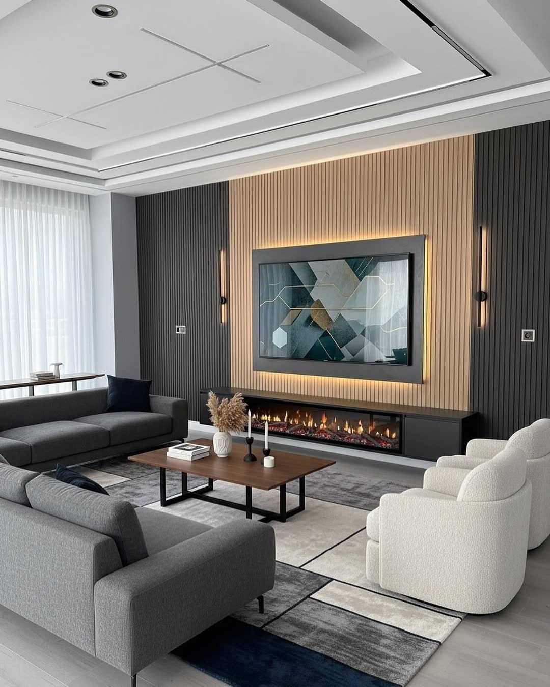 Modern drawing room with grey sofas, white armchairs, and a slatted wood feature wall.
