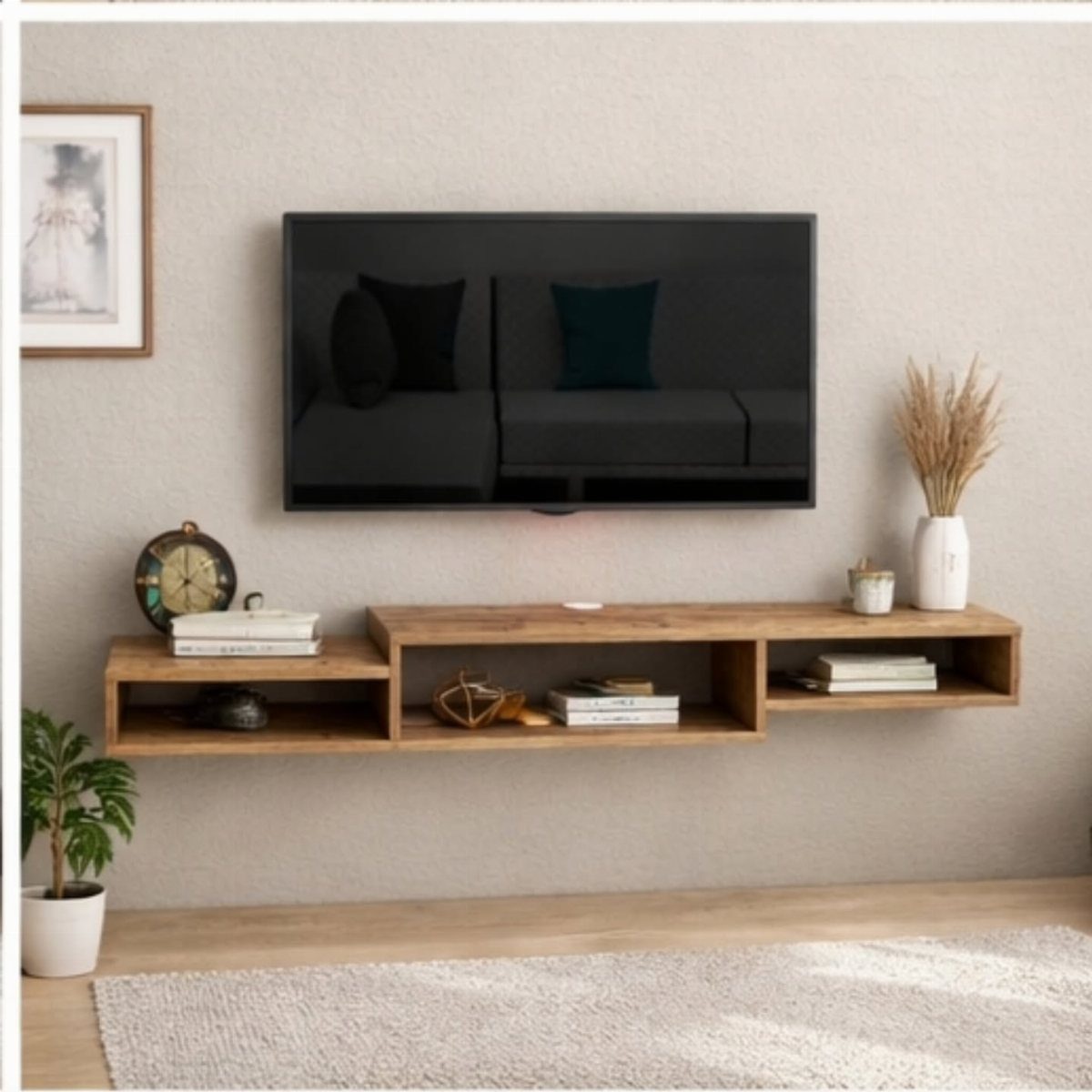 Wooden floating shelves under a wall-mounted TV with books and decorative accents.