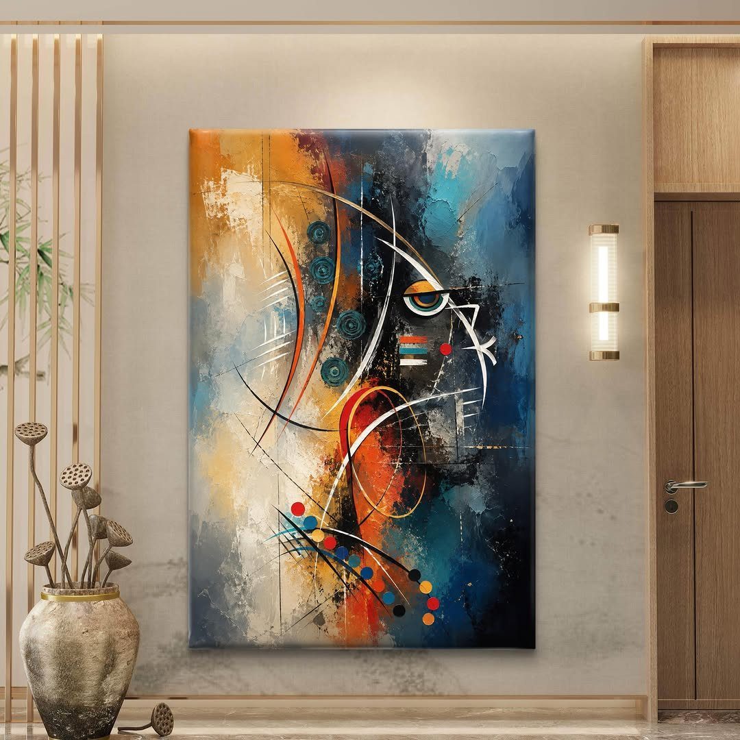 Large abstract painting with blue and orange tones on a neutral living room wall