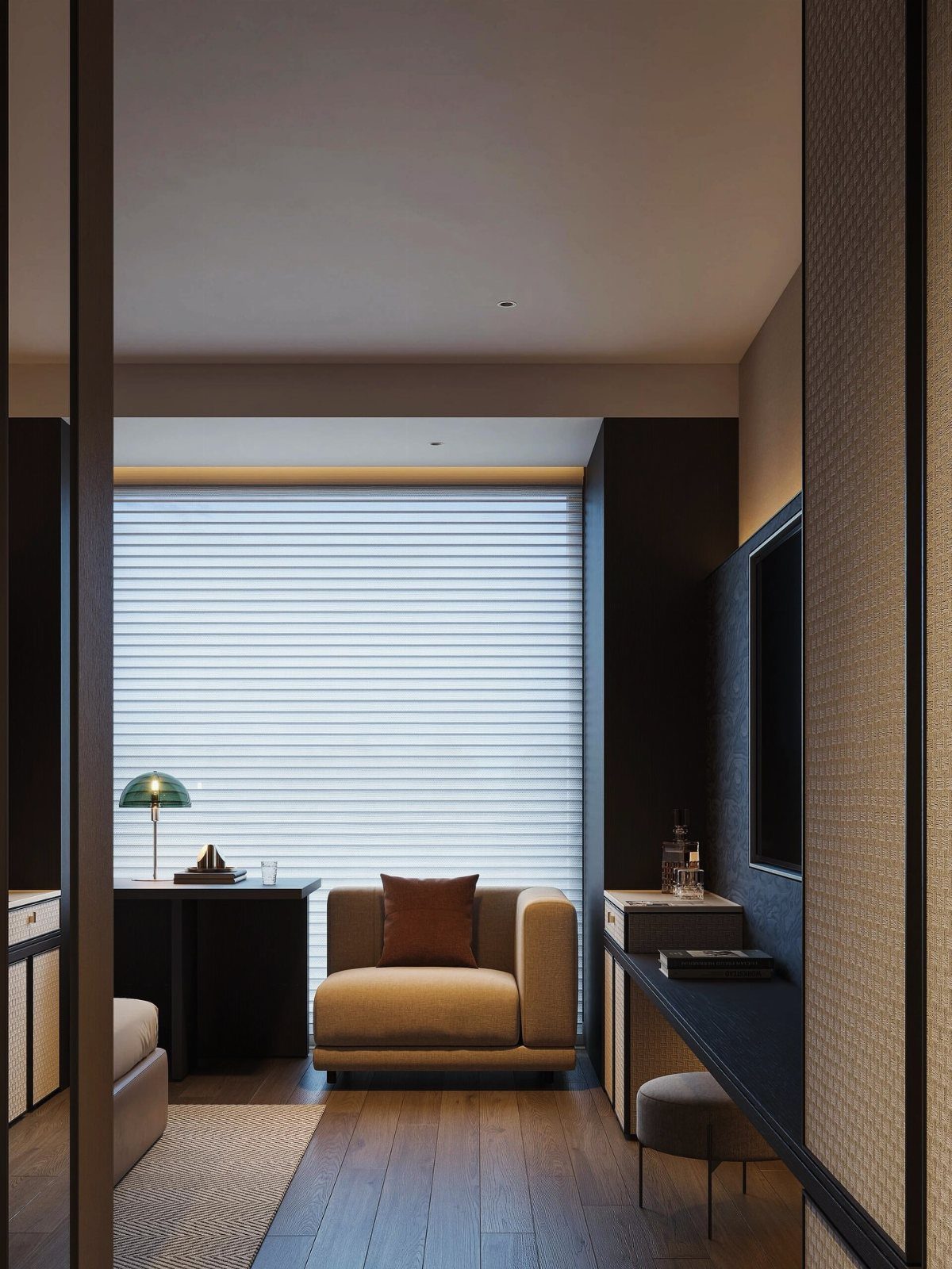 Modern hotel room interior with a tan armchair and dark wood accents.