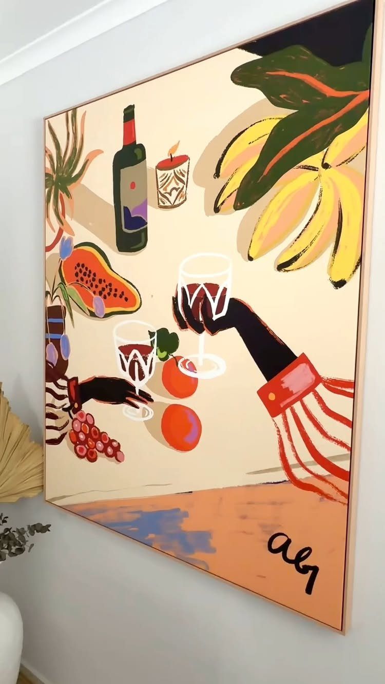 Large colorful canvas painting of a still life hanging on a grey wall.
