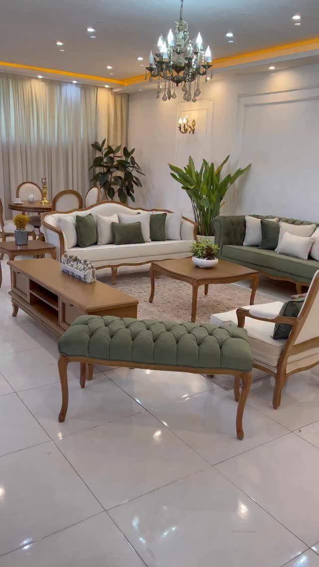 Olive green tufted bench and sofa in a bright, modern living room setting.