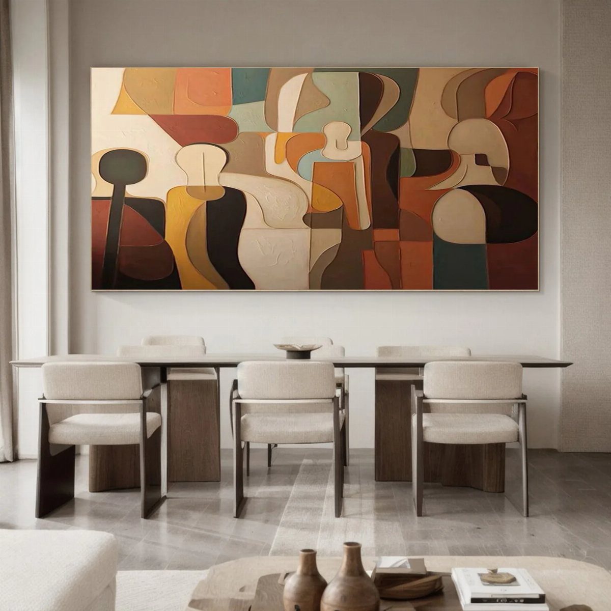 Large abstract painting in earthy tones hanging above a modern dining table set