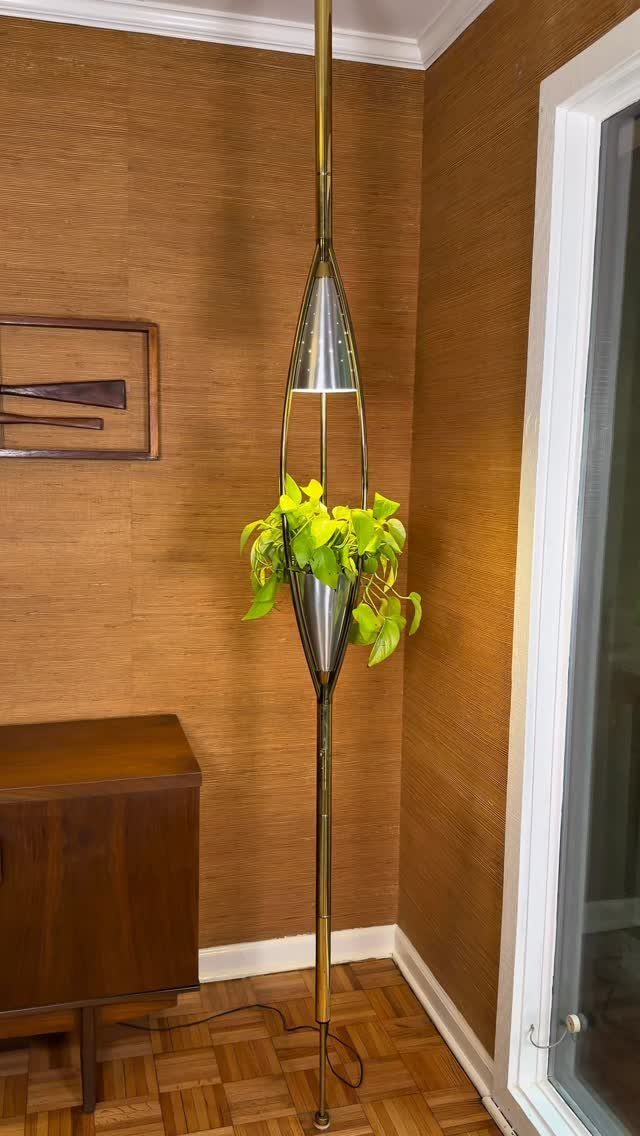 Gold mid century modern floor lamp with integrated planter and green foliage