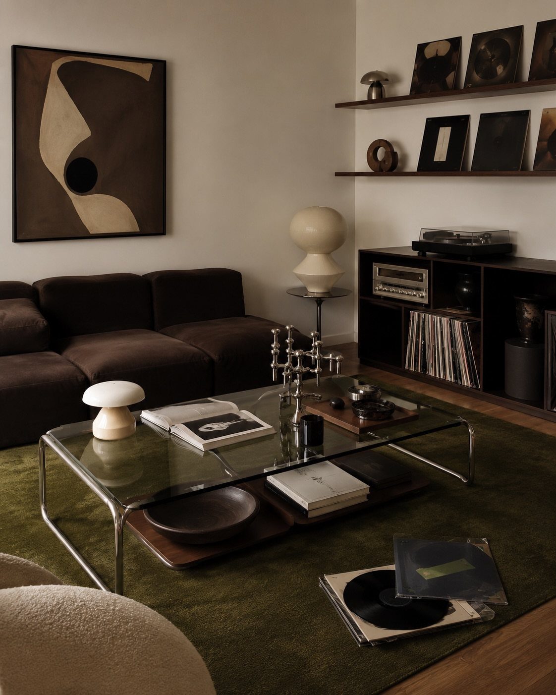 Glass coffee table with metal frame and wood shelf in a modern living room