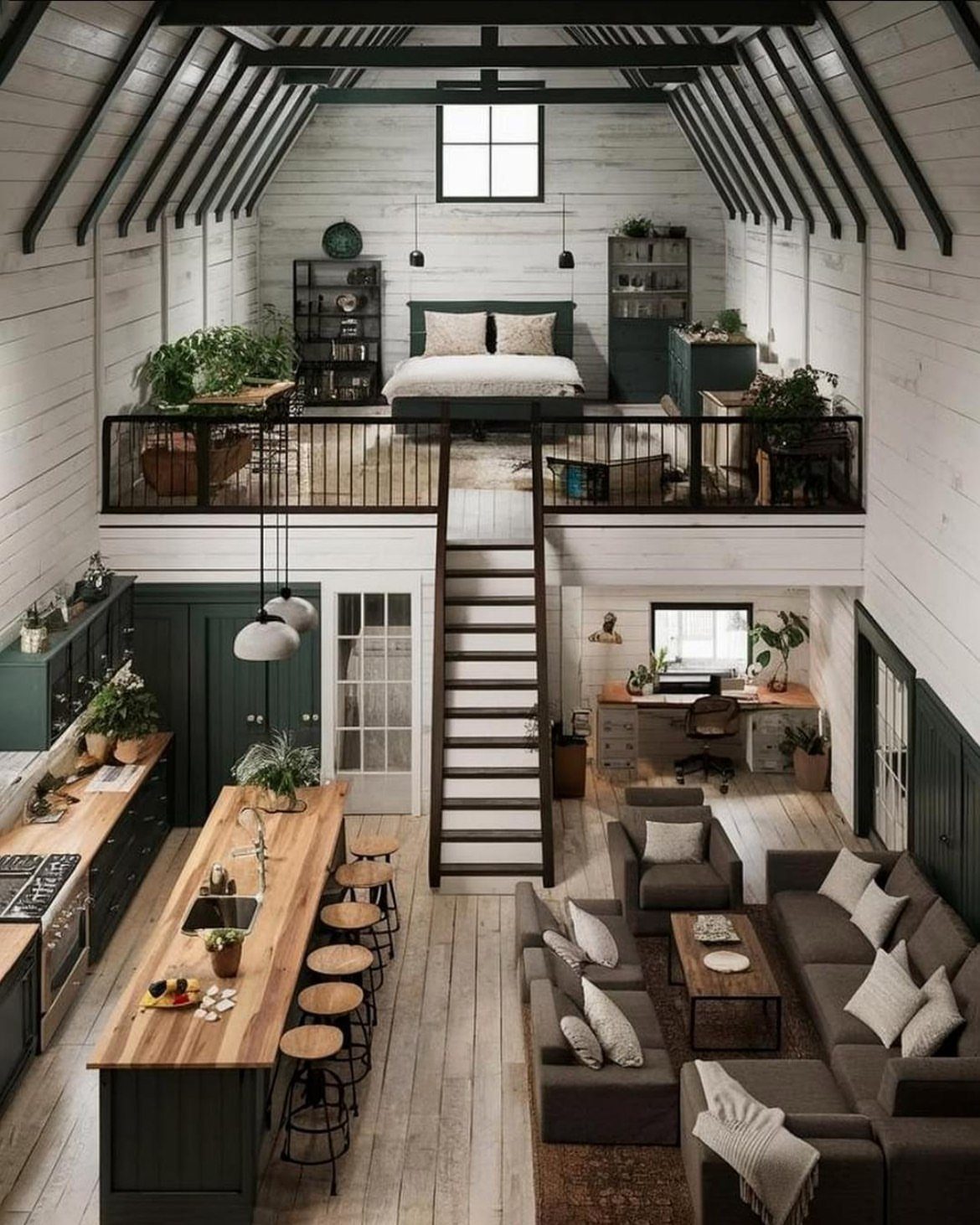 Modern barn interior with a loft bedroom, open living area, and home office.