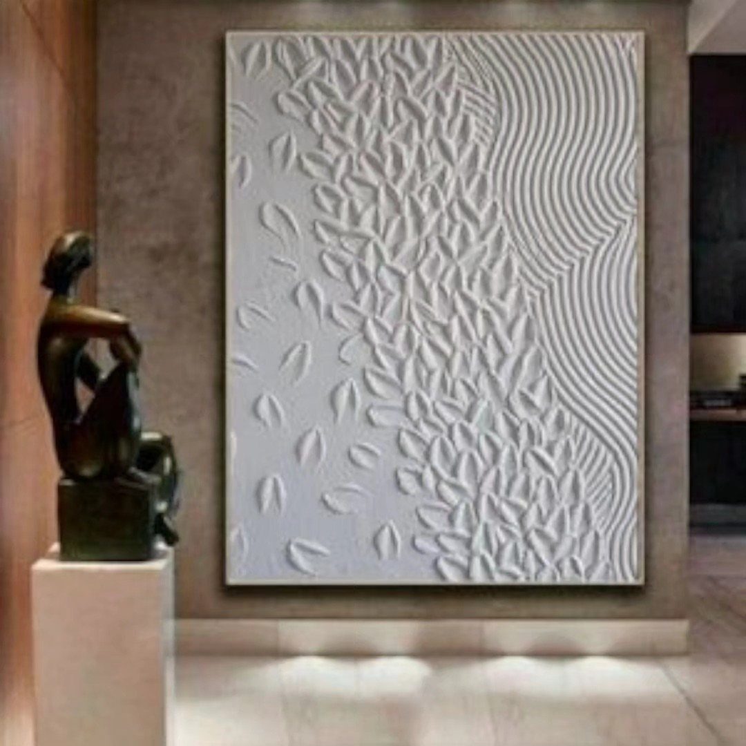 White 3D textured wall panel with organic patterns next to a bronze sculpture.