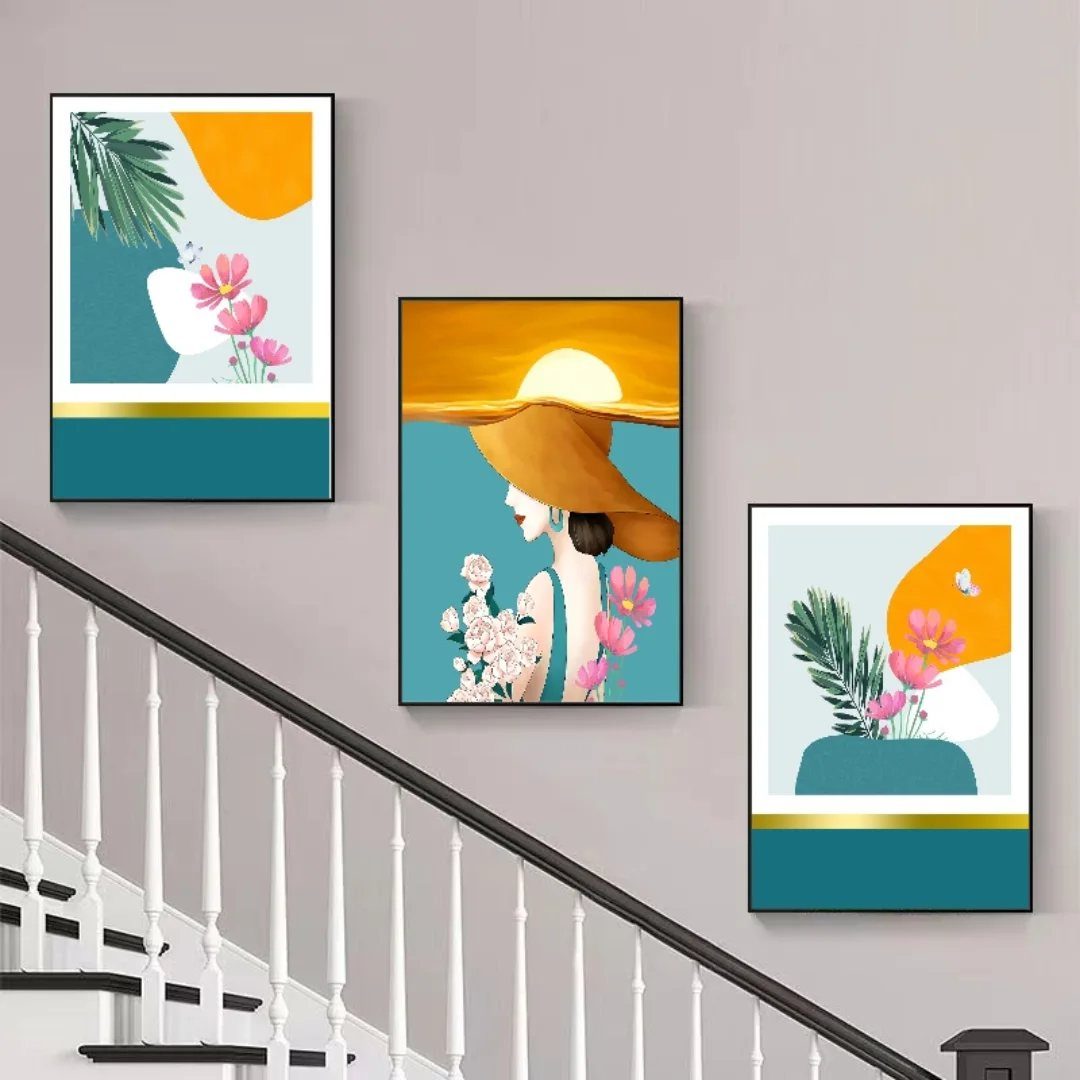 Three framed abstract paintings arranged diagonally on a wall above a staircase.