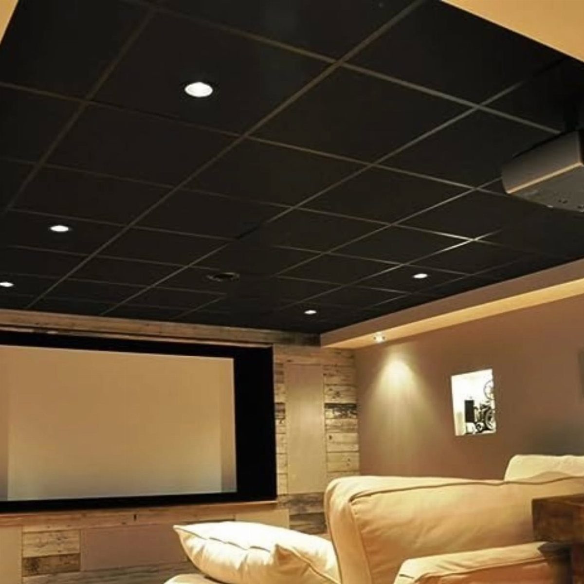 Home theater room with a black grid ceiling and white leather sofa.