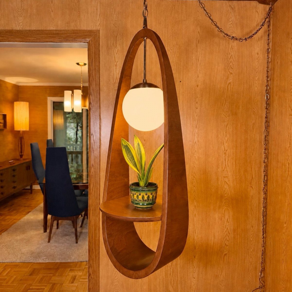 Mid-century modern wooden wall lamp with a frosted globe and small potted plant.